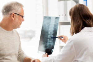 Doctor reviewing X-Ray with patient