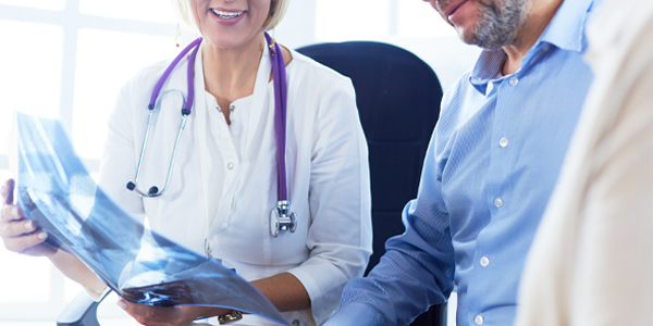 Close Up Image of Doctor explaining X-Ray to Patient