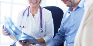 Close Up Image of Doctor explaining X-Ray to Patient