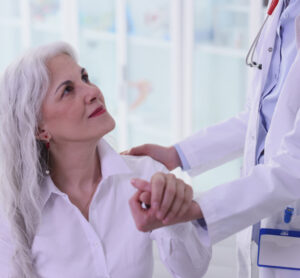 Senior-Female-Patient-Looks-At-doctor