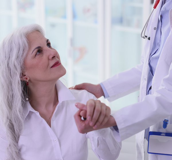 Senior-Female-Patient-Looks-At-doctor