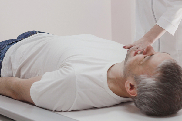 Male patient laying on XRay table