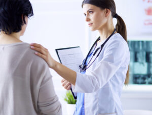 female doctor speaking with female patient