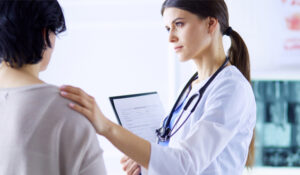 female doctor speaking with female patient