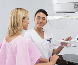 Patient with mammography technician