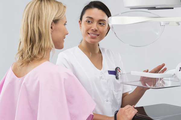 Patient with mammography technician