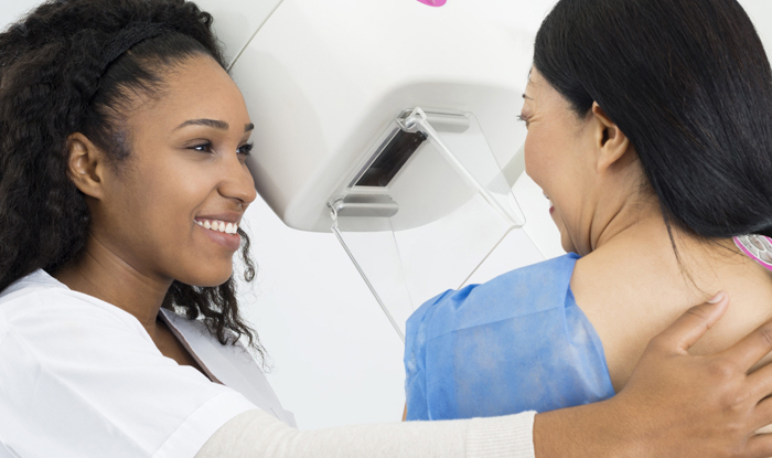 Mammography technician with patient